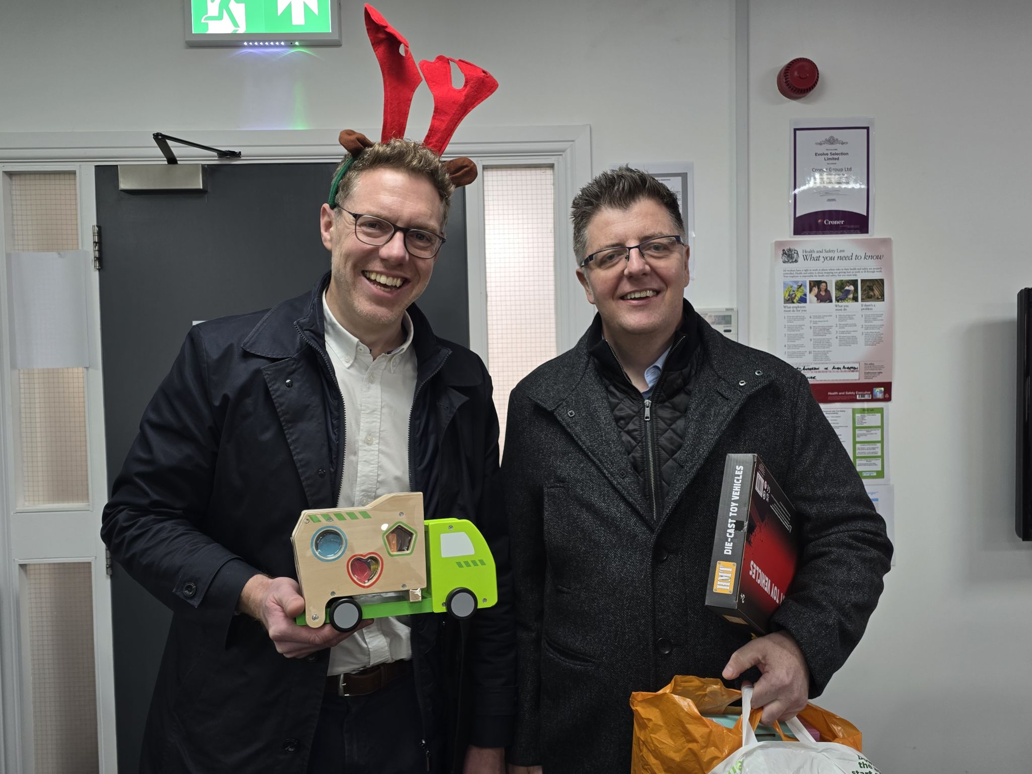 Chris and Andy delivering gifts for Mission Christmas.
