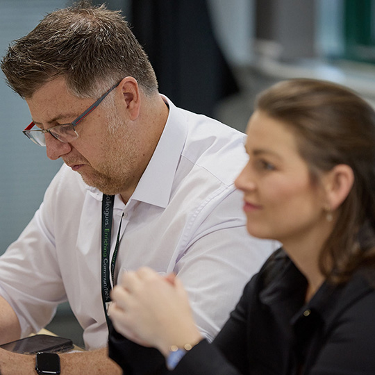Andy and Lauren in a training meeting.